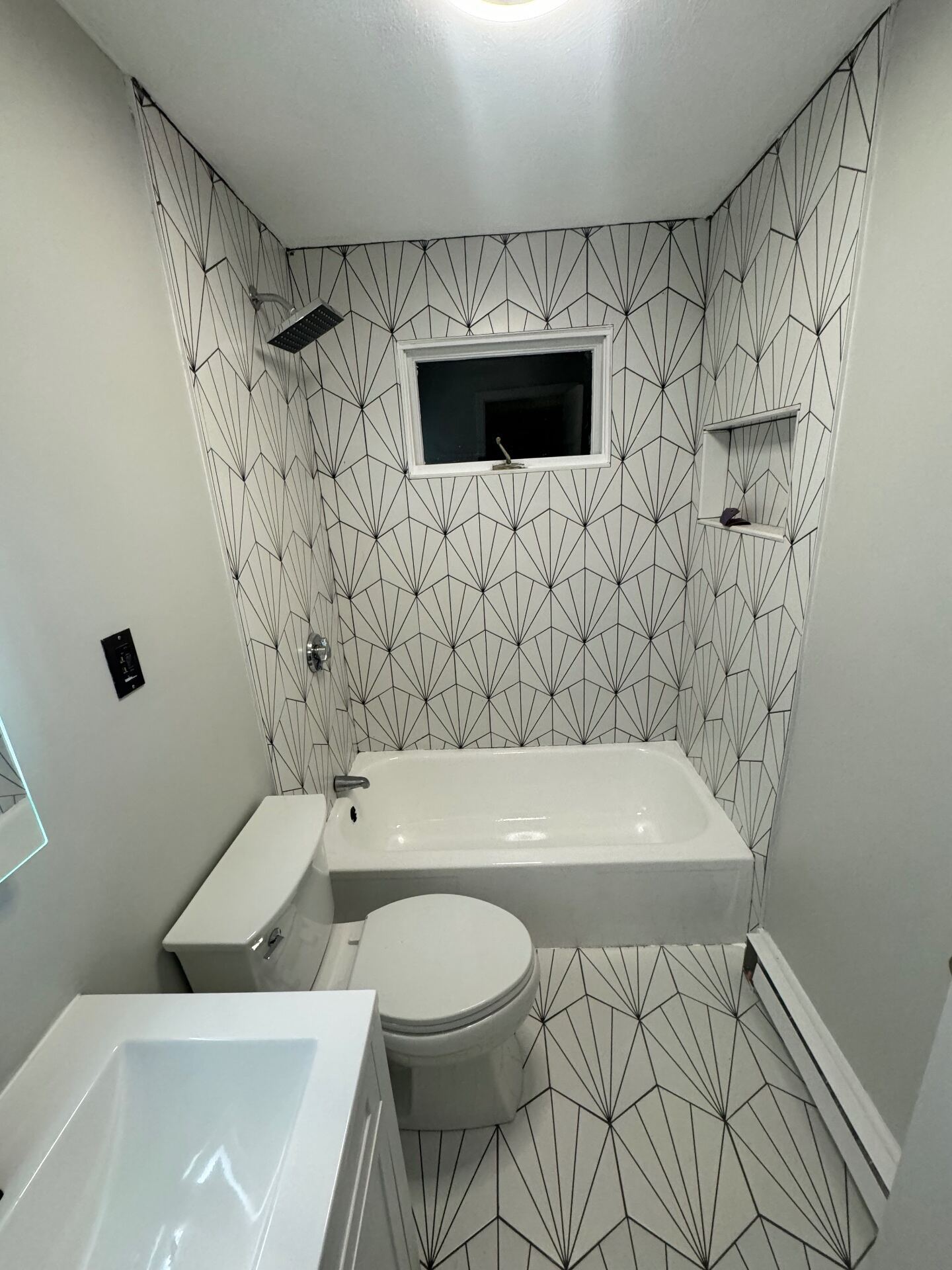 Art deco starburst tile tub surround